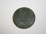 a close up of a coin on a table with a white background