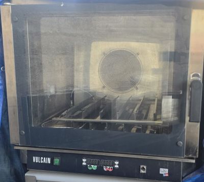 an image of a toaster oven sitting on top of a table