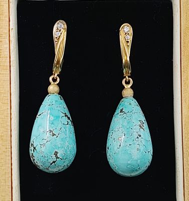 pair of turquoise turquoise and diamond earrings in a gold - plated box