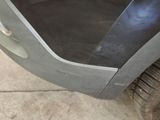 a close up of a car door with a brush in it