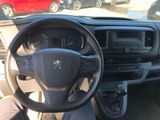 dashboard view of a car with a steering wheel and dashboard controls