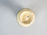 a small bowl that has a smiley face on it