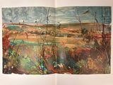 an open book with a painting of a landscape in the background