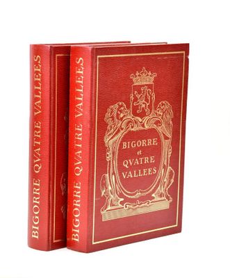 two red books sitting on top of each other on a white surface