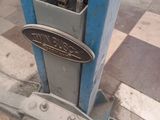 a close up of a blue machine with a sign on it