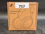 a box with a pair of headphones sitting on top of it