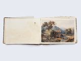 un livre ouvert dont la couverture représente une calèche