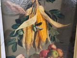 une photo d'un tableau représentant du maïs et des pommes posés sur une table