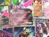 many different types of pokemon cards on the table