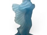a close up of a statue of a woman with a blue dress on a white background