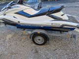 a white and blue jet ski on a trailer