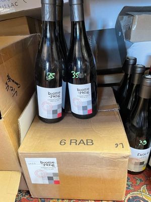 several bottles of wine sitting on top of a cardboard box