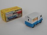 a small toy truck that is next to a box