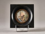 a small plate with a picture of a man on it