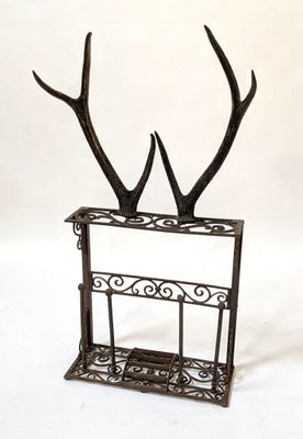 a metal rack with a deer ' s antlers on it