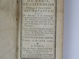 an old book opened to show the title of a poem