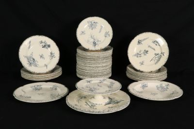 several plates and bowls sitting on top of each other on a black surface
