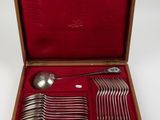 a wooden box with a set of silverware in it