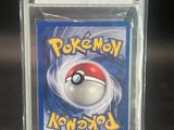 a close up of a pokemon card in a plastic case