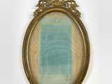 an old picture frame with a blue and white stripe in it
