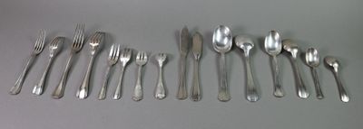 a lot of forks and spoons on the table