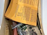 a cardboard box with a bunch of assorted items inside of it