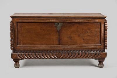 a wooden chest with a door on the top