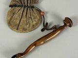 a small bag with a wooden handle and a wooden handle