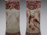 pair of chinese vases with birds and flowers on them