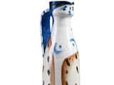 a white and blue vase with a dog on it