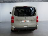 a silver van that is parked inside of a building