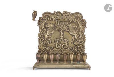 a gold plate with a bird on top of it