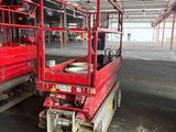 a red truck that is parked inside of a building