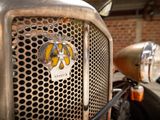 a close up of a car grill with a logo on it