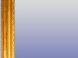 a mirror with a gold frame on the wall