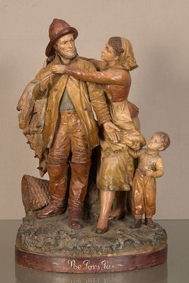 statue représentant un homme et deux enfants, placée à côté d'une statue représentant un homme et deux enfants