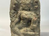 an image of a stone sculpture of a man holding a child