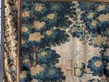 an image of a tapestry hanging on a wall in a room