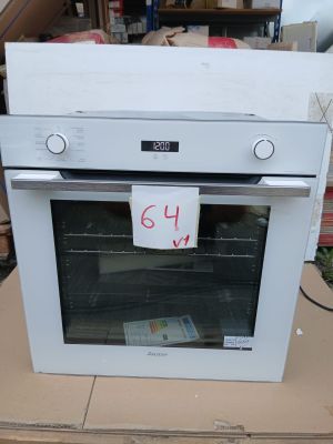 a white oven sitting on top of a cardboard box