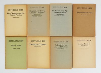 six books are stacked on top of each other on a white surface