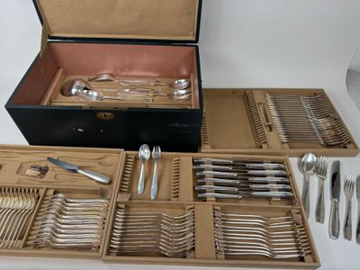 many different types of silverware in a box
