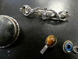 three different types of jewelry sitting on a table