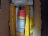 a box with a hair dryer, comb, and other items in it