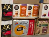 boxes of coffee are stacked on top of each other in a store