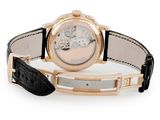 a close up of a wrist watch with a black leather strap