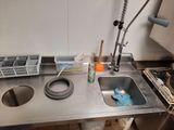 a sink in a kitchen with a lot of dirty dishes