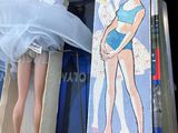 a barbie doll that is sitting on top of a box