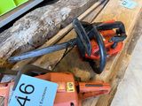 a chainsaw sitting on a table with a price tag on it