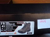 a box with a pair of boots on top of it