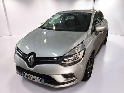 the silver car is parked in the white room of the showroom
